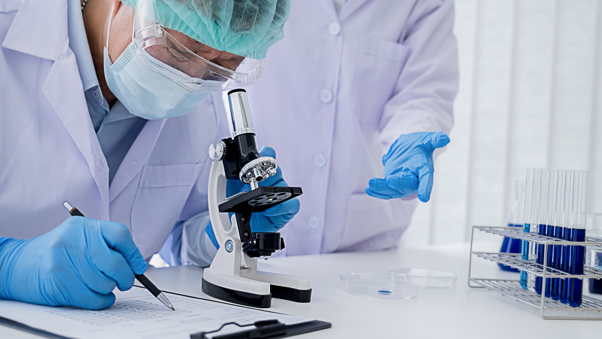 Scientist Using a Microscope